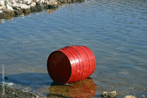 Obraz na płótnie Red barrel near the shore of the sea in Simuni on the island of Pag, Croatia w salonie