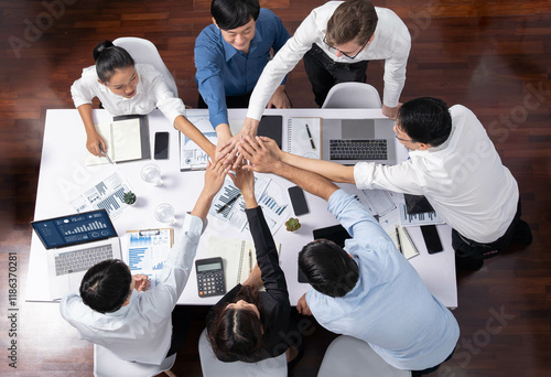 Tableau sur toile Top view diverse office worker join hand together in office room symbolize business synergy and strong productive teamwork in workplace