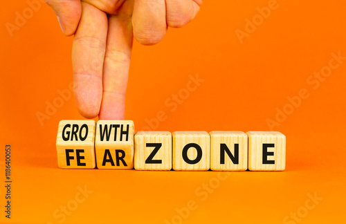 Growth or fear zone symbol. Concept words Growth zone Fear zone on wooden cubes. Beautiful orange table orange background. Psychologist hand. Business and growth or fear zone concept. Copy space. photo