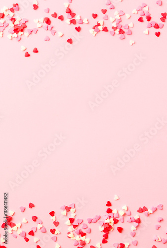 Sugar hearts frame on pink background. Romantic, St Valentines day concept. Top view. Copy space.