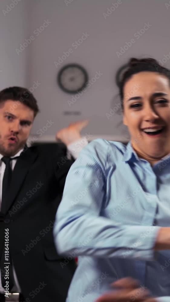 Three joyful businesspeople businesswoman and two businesman dancing cheerfully in office. We happy of friday ending in 4k Ultra hd resolution. Vertical Shot. Three joyful businesspeople businesswoman and two businesman dancing cheerfully in office. We happy of friday ending in 4k Ultra hd resolution. Vertical Shot.