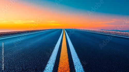 Sunset journey on a long stretching road scenic landscape travel photography vibrant sky wide viewpoint adventure concept