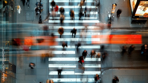 A dynamic aerial view of bustling pedestrian activity at a vibrant city crosswalk under bright city lights.