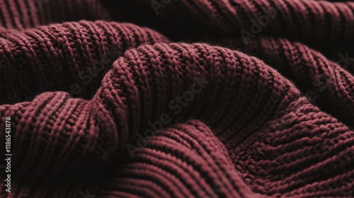 Cozy claret knitted sweater texture close up Warm dark wool background for comfort and style in fashion and interior design concepts photo