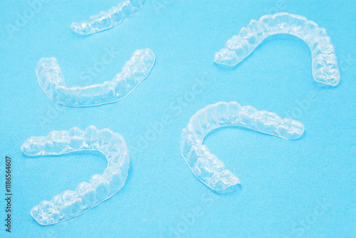 Invisible dental bracket aligners for modern orthodontic treatment to straighten teeth and improve dental hygiene. Cosmetic dentistry orthodontics dental wire teeth brackets teaching student