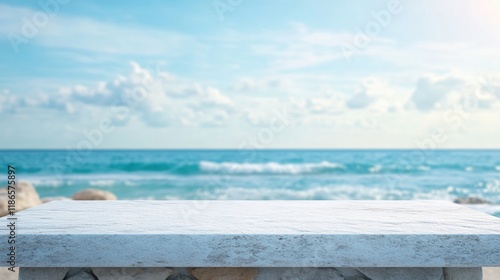 Fototapeta Naklejka Na Ścianę i Meble -  White stone table with blurred beach sea background ideal for summer product display and advertising opportunities