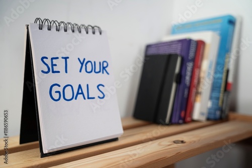 Obraz na płótnie otwarty notes na półce z kartką na której zapisany jest tekst: Set your goals w salonie