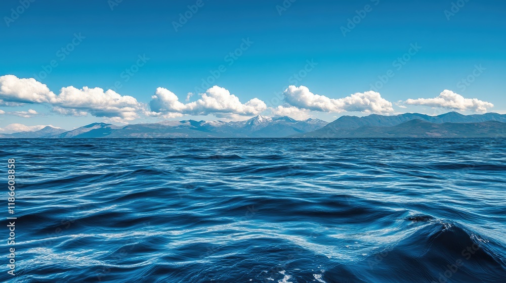 Expansive ocean seascape with clear blue sky clouds and gentle waves ideal for travel and holiday themed projects showcasing nature beauty. Expansive ocean seascape with clear blue sky clouds and gentle waves ideal for travel and holiday themed projects showcasing nature beauty.