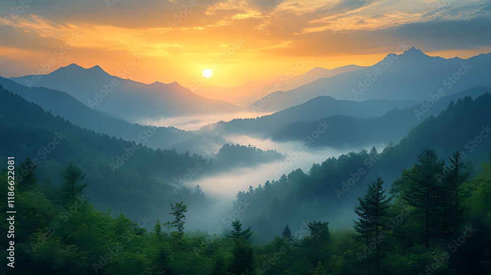 Obraz premium Majestic sunrise over misty mountain valley.