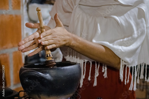 Sao Paulo, SP, Brazil - December 14 2024: Close-up of woman preparing cacao for ceremony details.