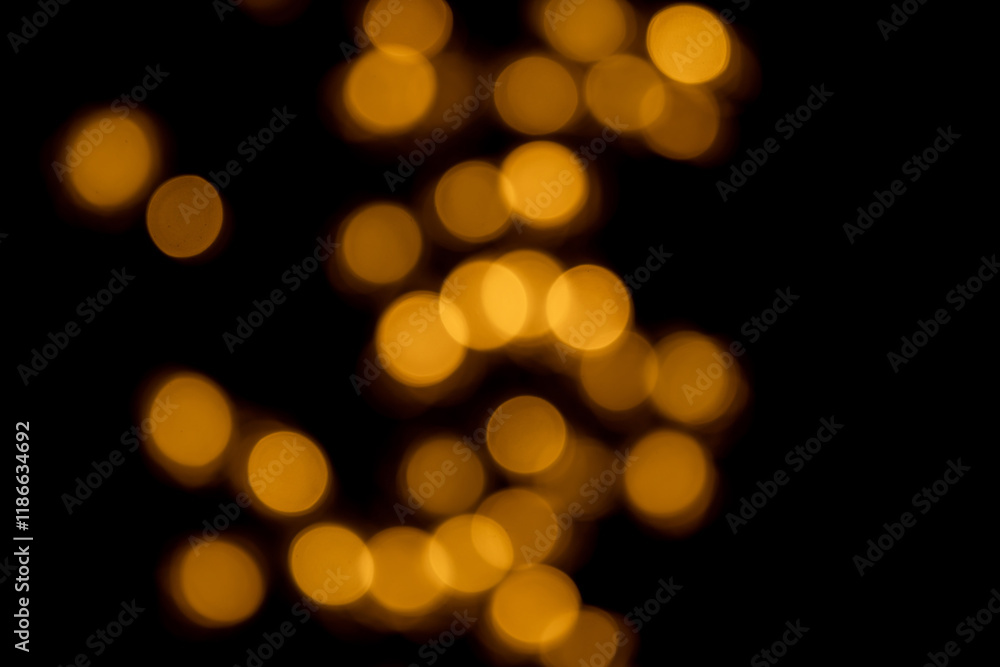 Fototapeta premium golden bokhe at night,Beautiful blurred light bokhe for background material.