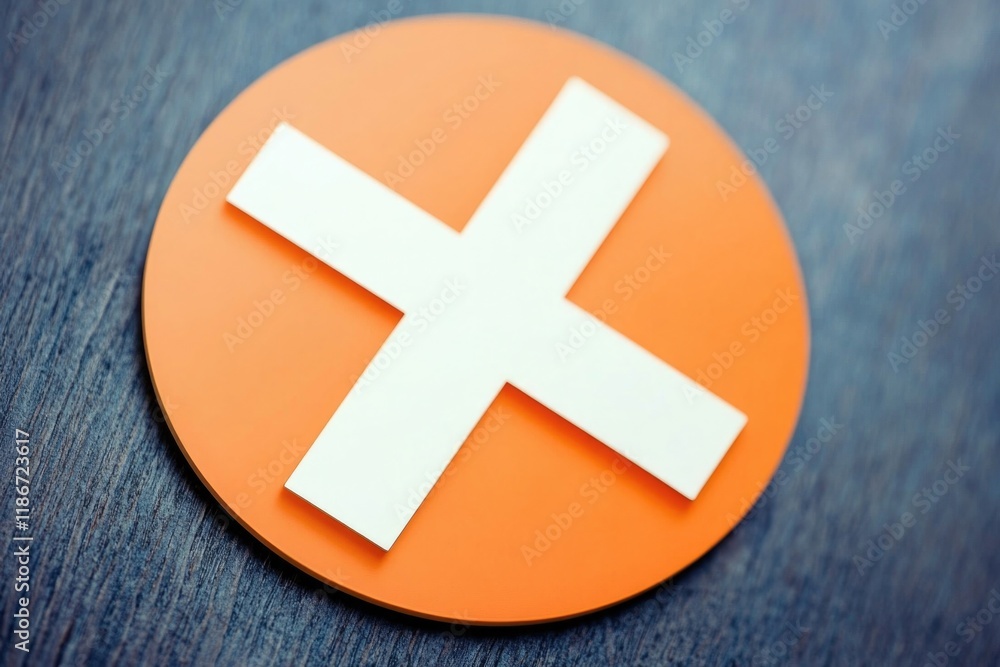 Obraz premium A simple orange button with a white medical cross icon