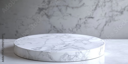 A round tabletop made of white marble sits in the foreground, with a scene behind it that is slightly out of focus. The background features a white and grey toned studio setting. photo