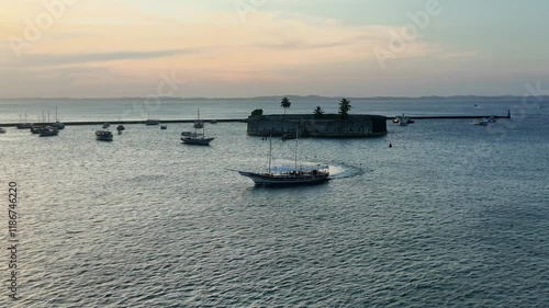 Wallpaper Mural Boat making their way back to the port with a vibrant orange sunset backdrop. 
 Torontodigital.ca