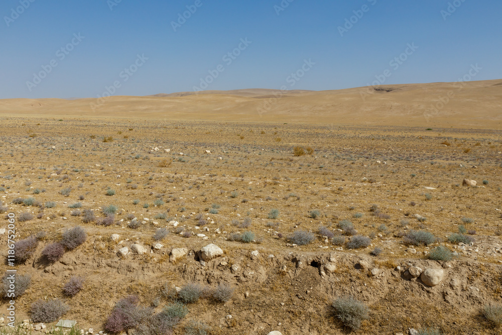 Landscape view of arid terrain in Kunduz Province, Afghanistan during a clear day Landscape view of arid terrain in Kunduz Province, Afghanistan during a clear day