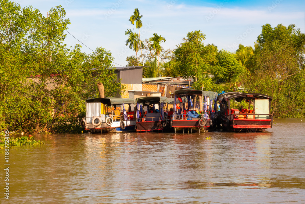 Traditional wooden boats on Mekong river in Vietnam Traditional wooden boats on Mekong river in Vietnam