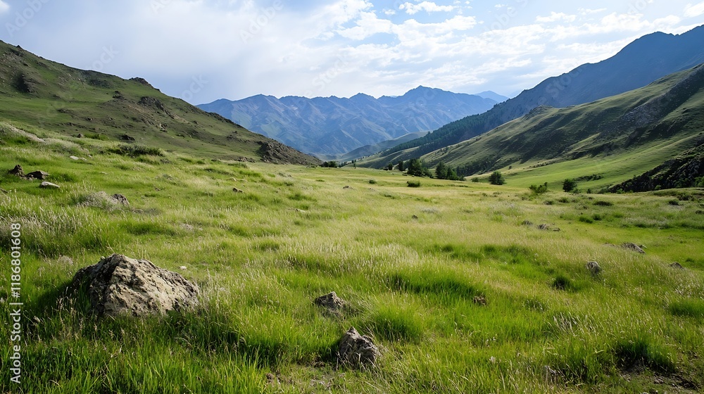 Fototapeta premium Scenic mountainous landscape with lush green grass and distant rugged peaks under a clear blue sky : Generative AI