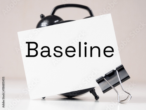 Fotografie Baseline text meaning on white note paper background alarm clock