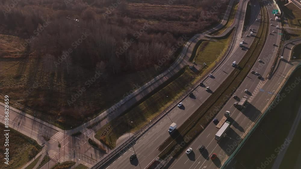Aerial view of busy highway traffic flowing through scenic interchange Aerial view of busy highway traffic flowing through scenic interchange