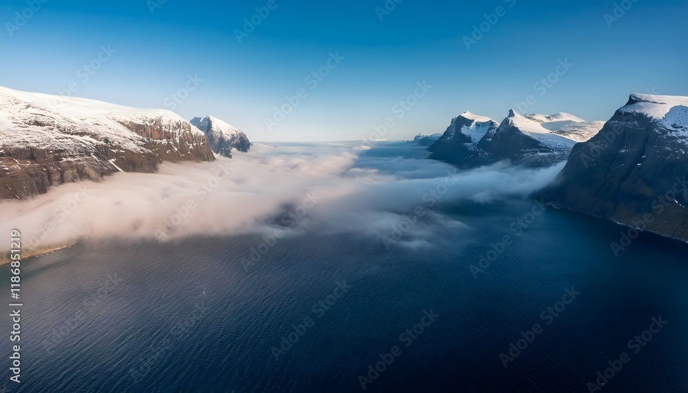 Obraz premium Aerial View Dramatic Snow Capped Mountains Misty Fjord Ocean Panorama