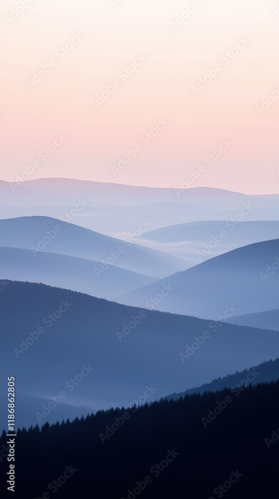 Obraz premium Serene mountain landscape with soft blue hues and gentle slopes