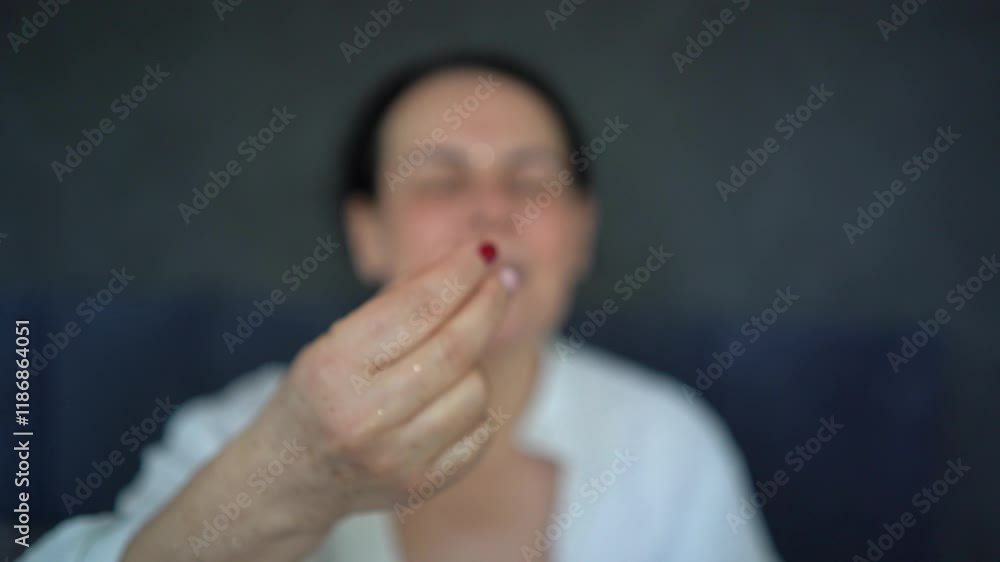senior woman in underwear with gold glitter on her face and hands takes vitamins, Perimenopause Supplement senior woman in underwear with gold glitter on her face and hands takes vitamins, Perimenopause Supplement