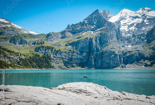 Blue lake under majestic peaks