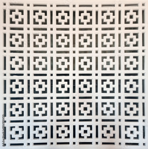 Gypsum geometric shapes in interior. Geometric design. Beautiful ornament background close-up. Seamless plaster ornament with geometric squares. Abstract background
