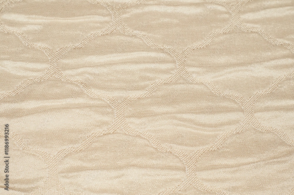 Creative background made of silk fabric with beige pattern Creative background made of silk fabric with beige pattern