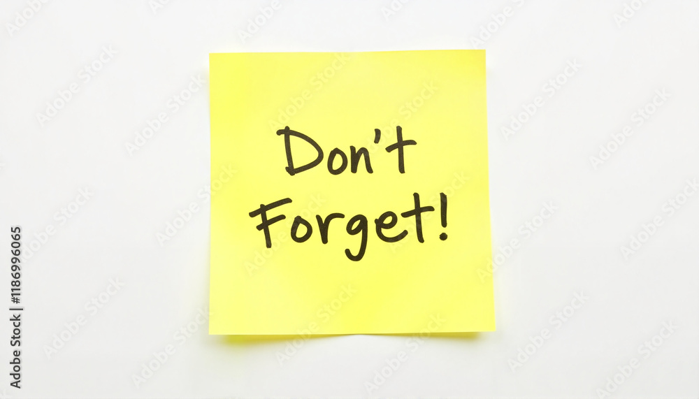 Bright yellow sticky note with reminder on clean white surface, organization, National Memo Day Bright yellow sticky note with reminder on clean white surface, organization, National Memo Day