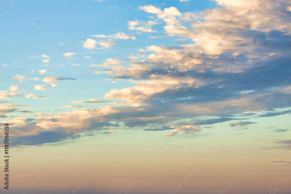 A beautiful sky tinted by the sun leaving vibrant shades of gold, pink, blue and multicolored. Clouds in the twilight evening and morning sky. Cloudy sky background in the evening, and during the day. A beautiful sky tinted by the sun leaving vibrant shades of gold, pink, blue and multicolored. Clouds in the twilight evening and morning sky. Cloudy sky background in the evening, and during the day.