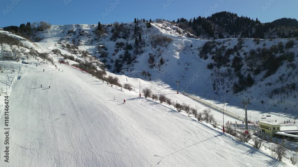 Almaty, Kazakhstan - 01.10.2025 : Ski slope for skiing and snowboarding. The view from the drone. Almaty, Kazakhstan - 01.10.2025 : Ski slope for skiing and snowboarding. The view from the drone.