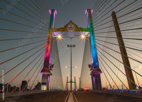 Obraz na płótnie Beautiful scenery of Thotsamarachan Bridge (Rama IX Bridge) crossing Chao phraya river with evening sky in the background. use it as your Wallpaper, Poster and Copy space, Selective focus. w salonie