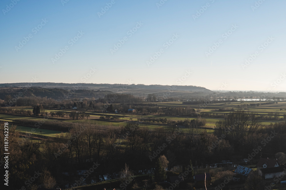 Fototapeta premium nostalgic autumn landscape with empty fields in the vistula valley
