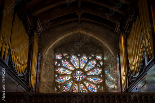 Church organ, stained glass, worship space.