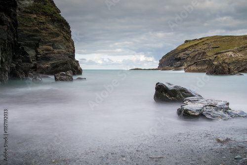 Coastal rocks, misty water, slow shutter speed.