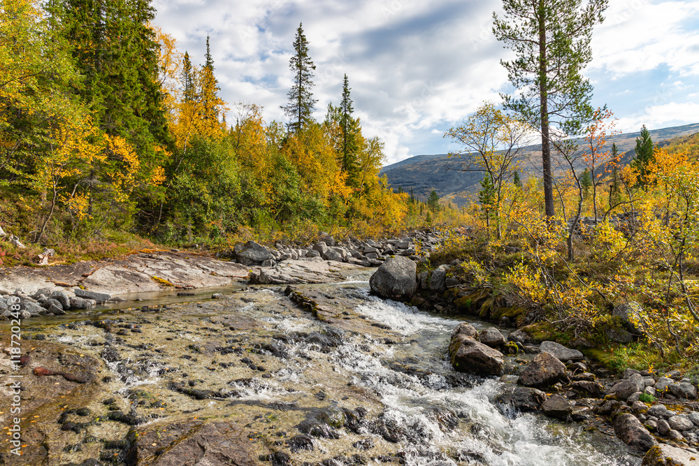 View to Mannepakhp river at Khibiny mountains. Early autumn in arctic tundra region. Kola peninsula, Murmansk region, Russia.