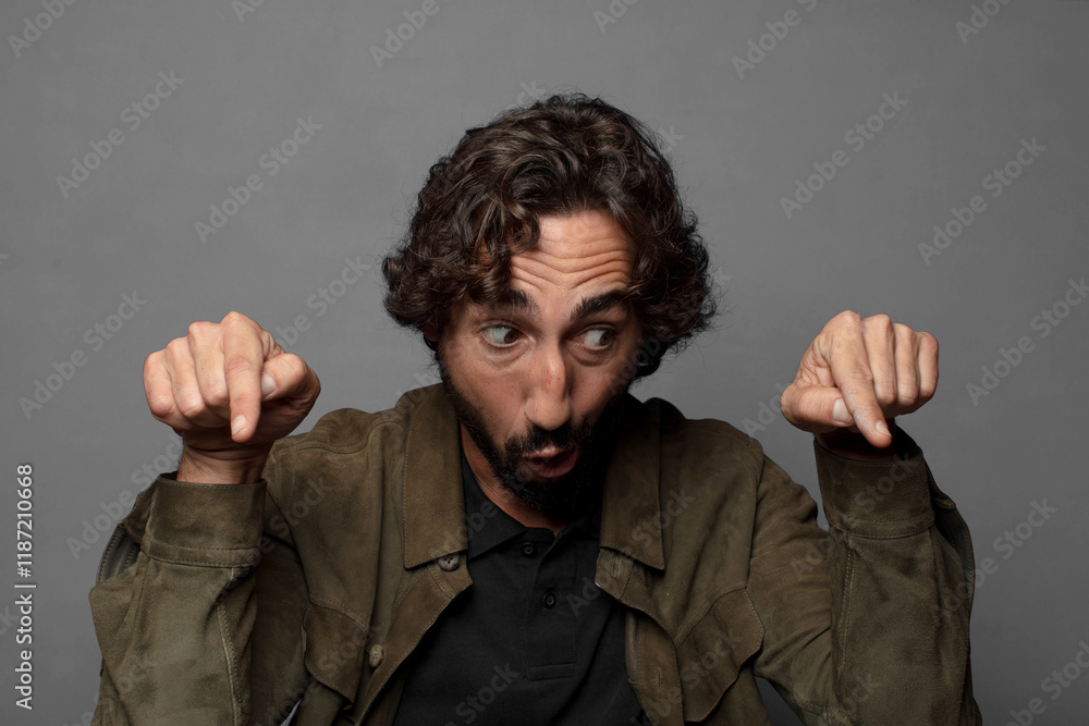 with open mouth pointing downwards with both hands, looking shocked, amazed and surprised with open mouth pointing downwards with both hands, looking shocked, amazed and surprised