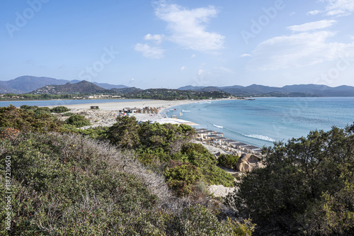 Obraz na płótnie VIllasimius, Italy - 09-05-2024: Aerial view of the beautiful beach of Porto Giunco in Villasimius with white sand and crystal clear water with the Notteri pond in the background w salonie