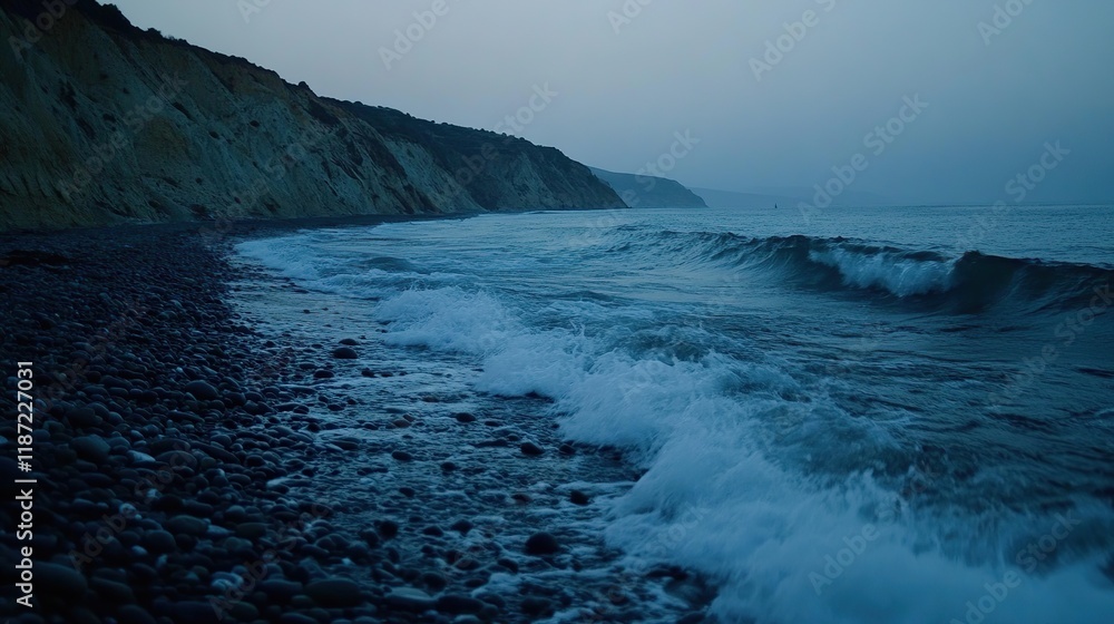 Fototapeta premium Serene twilight coastal scene, waves crashing on pebble beach near cliffs.