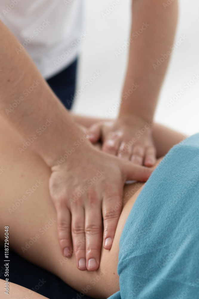 relaxing massage and body shaping massage, lymphatic drainage, manual and aesthetic procedures, hands massaging belly in the spa salon relaxing massage and body shaping massage, lymphatic drainage, manual and aesthetic procedures, hands massaging belly in the spa salon