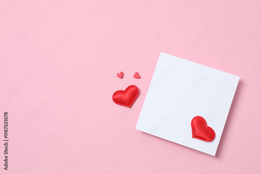 Paper card with red hearts on color background Paper card with red hearts on color background