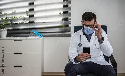 Close up portrait of handsome Caucasian senior joyful male doctor infectionist in white coat sitting in cabinet in clinic at work talking on video call online through webcam with patient medic concept photo