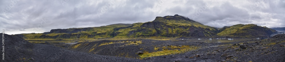 Fototapeta premium Solheimajokull glacier in Katla Geopark on Icelandic Atlantic South Coast. June 2024 South glacial tongue of Myrdalsjokull ice cap, near Vik village, Iceland, Europe