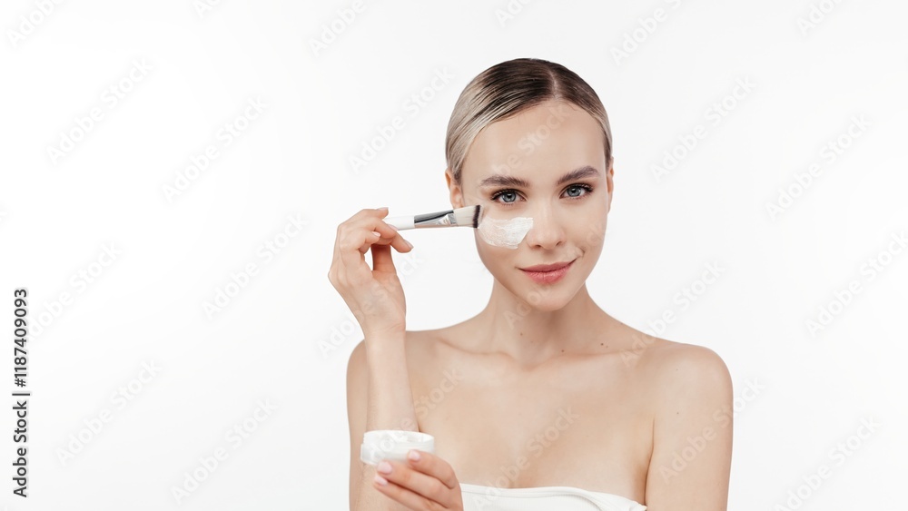 Cream smear. Beauty close up portrait of young woman with a healthy skin is applying a facial skincare product. Face cream refreshing look. White background. Natural beauty, cosmetology. Copy space Cream smear. Beauty close up portrait of young woman with a healthy skin is applying a facial skincare product. Face cream refreshing look. White background. Natural beauty, cosmetology. Copy space