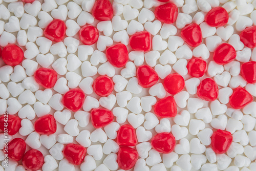 Red and White candy laying flat on a white background