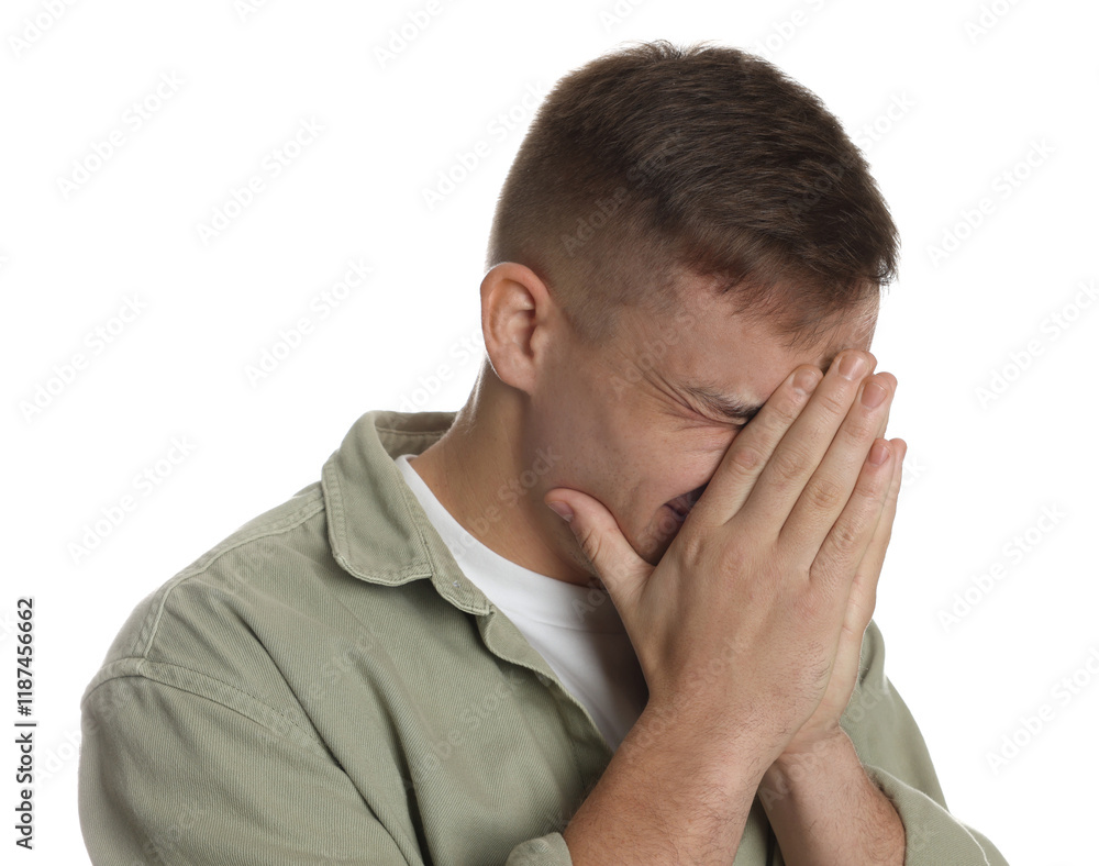 Distressed young man crying on white background Distressed young man crying on white background