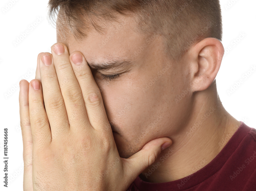 Distressed young man crying on white background Distressed young man crying on white background