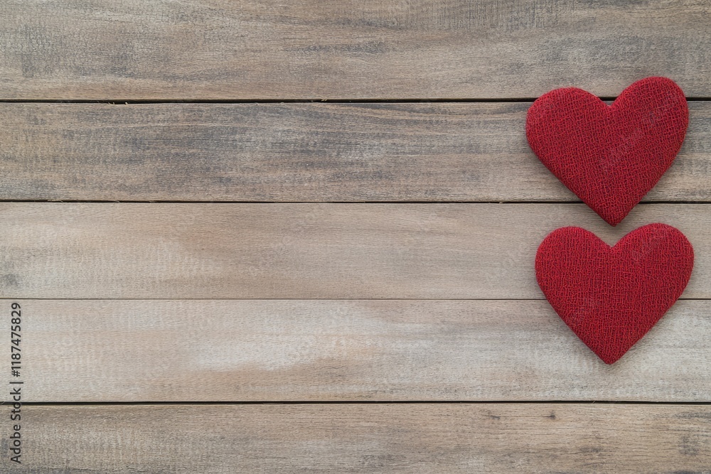 Valentines day background with two red hearts on wooden background 