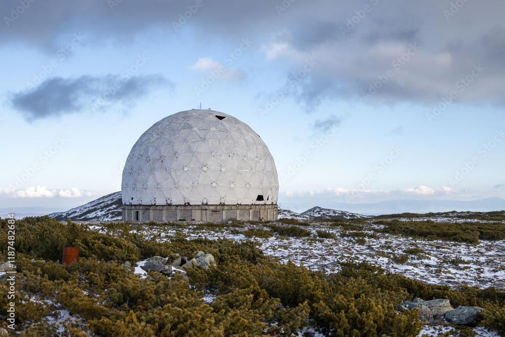Obraz premium Abandoned dome of an old Soviet military radar from the Cold War. A huge structure in the form of a white sphere on a mountain in the vicinity of Magadan. Magadan region, Siberia, Russian Far East.
